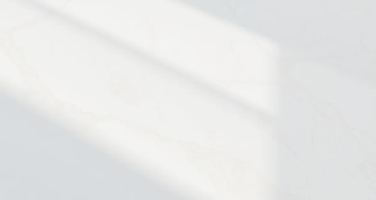 Close-up of polished marble countertop showing natural veining patterns and luxurious finish for kitchen or bathroom installation.